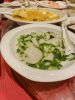 Sautéed nian gao (rice cakes) with vegetables from Lao Jishi